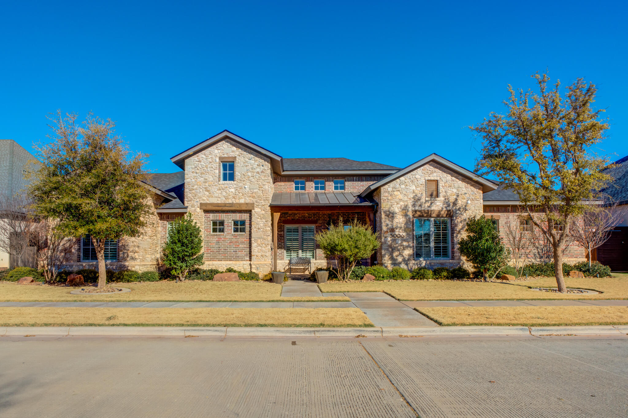5006 117th Street Lubbock, TX 79424 - Photo 2 of 88 a front view of a house with a yard