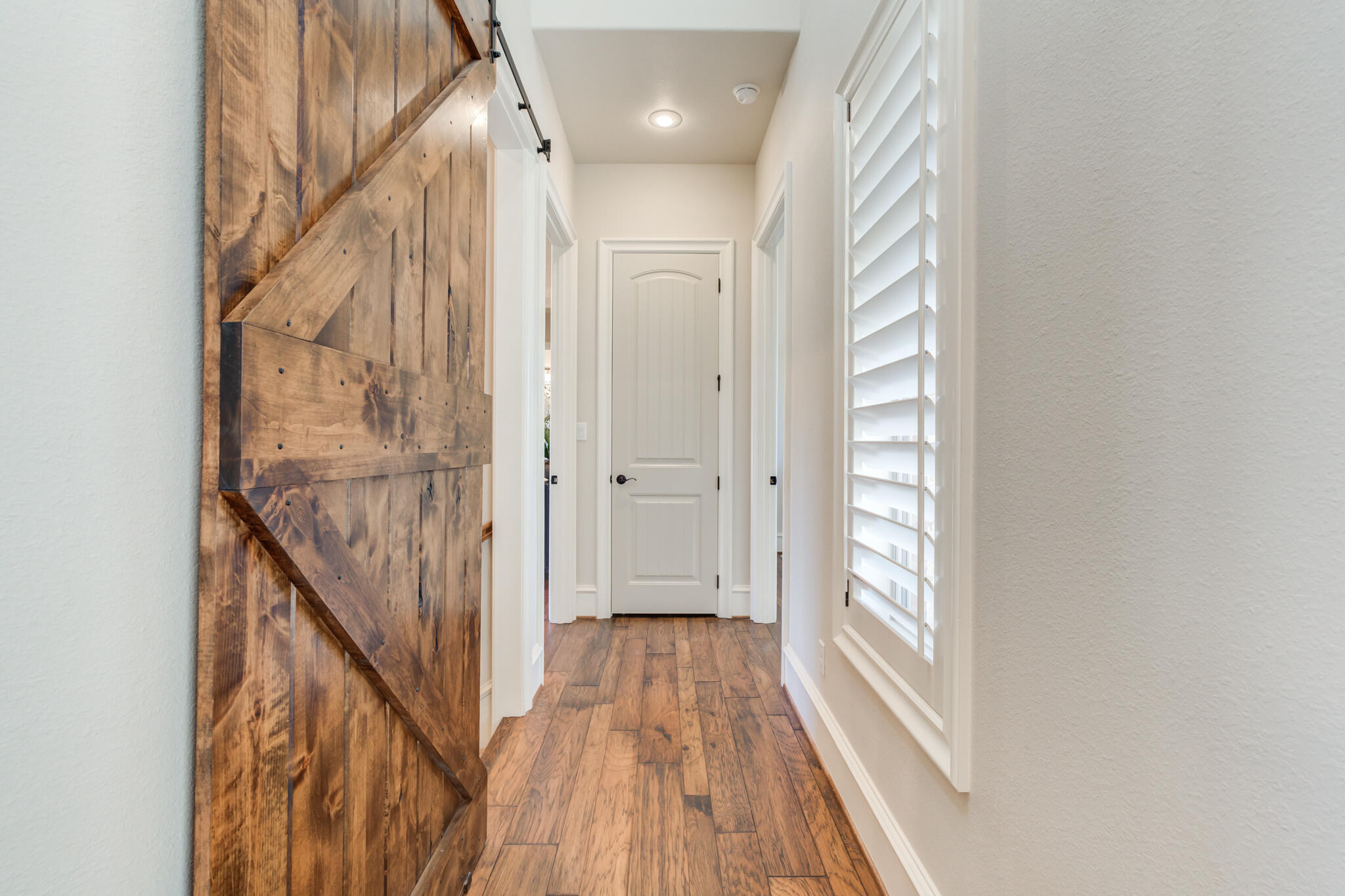 5006 117th Street Lubbock, TX 79424 - Photo 51 of 88 a view of a hallway with wooden floor and entryway