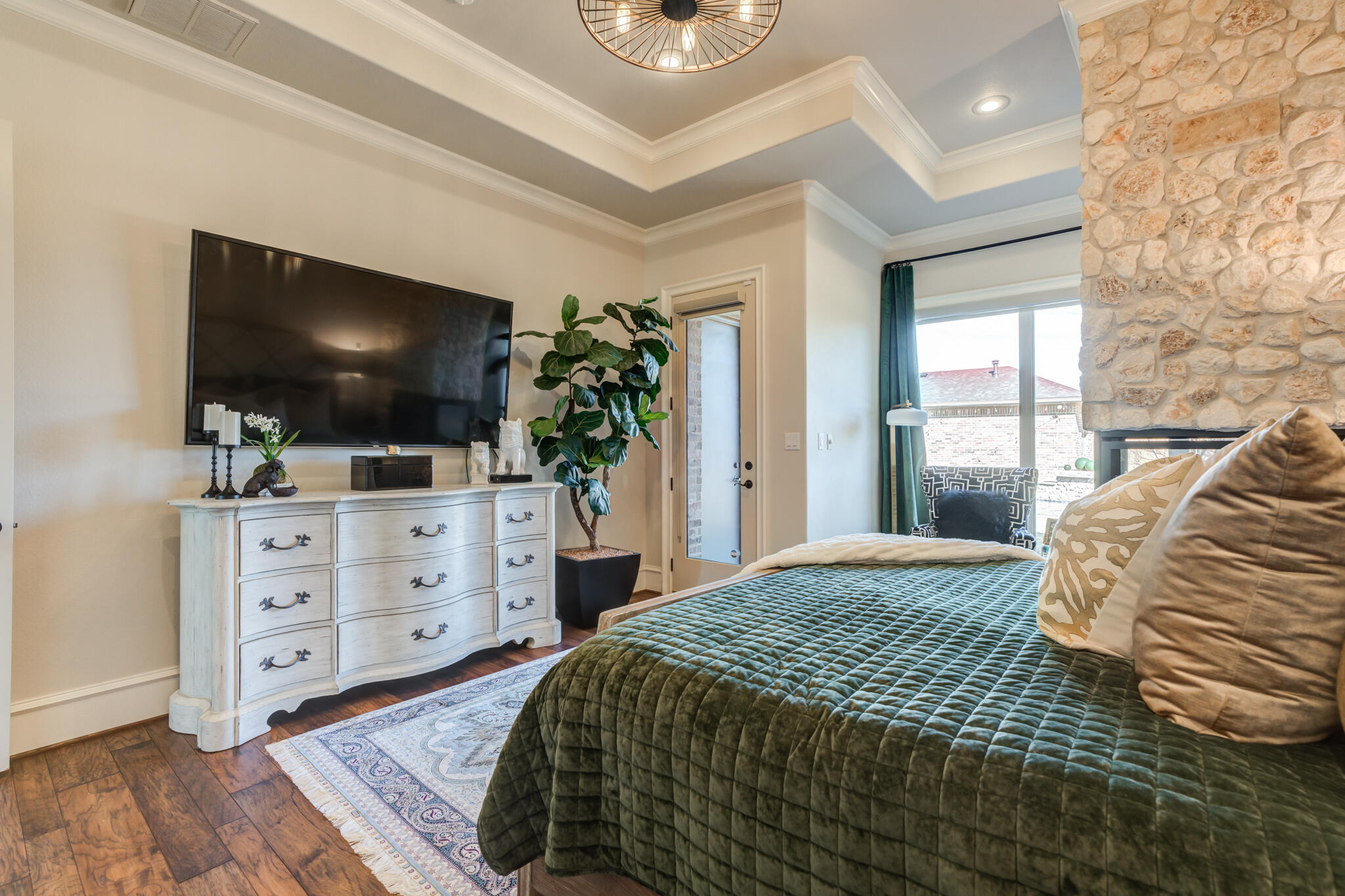 5006 117th Street Lubbock, TX 79424 - Photo 58 of 88 a bedroom with a bed and flat screen tv
