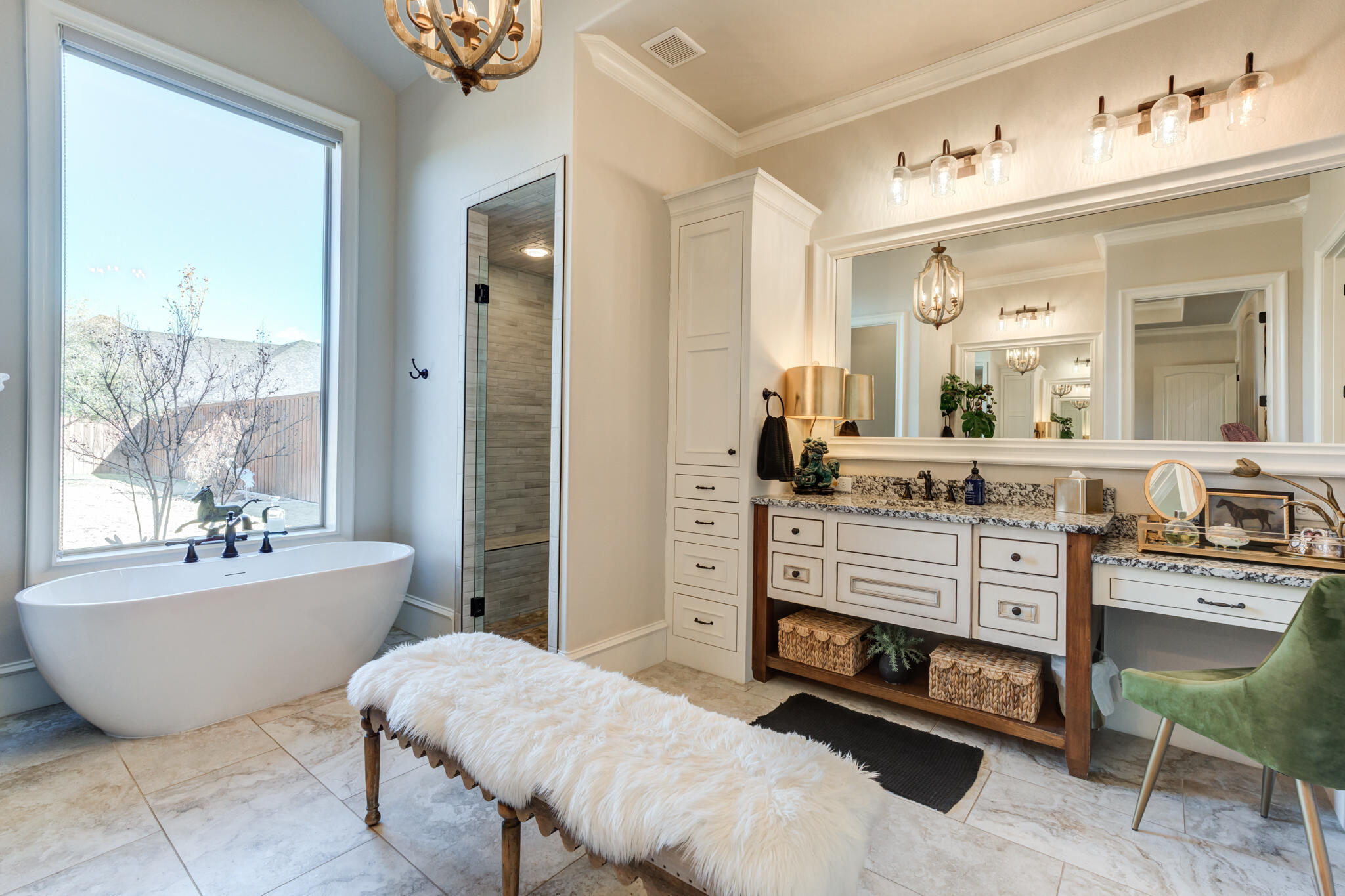5006 117th Street Lubbock, TX 79424 - Photo 59 of 88 a spacious bathroom with a double vanity sink a mirror a bathtub and next to a window