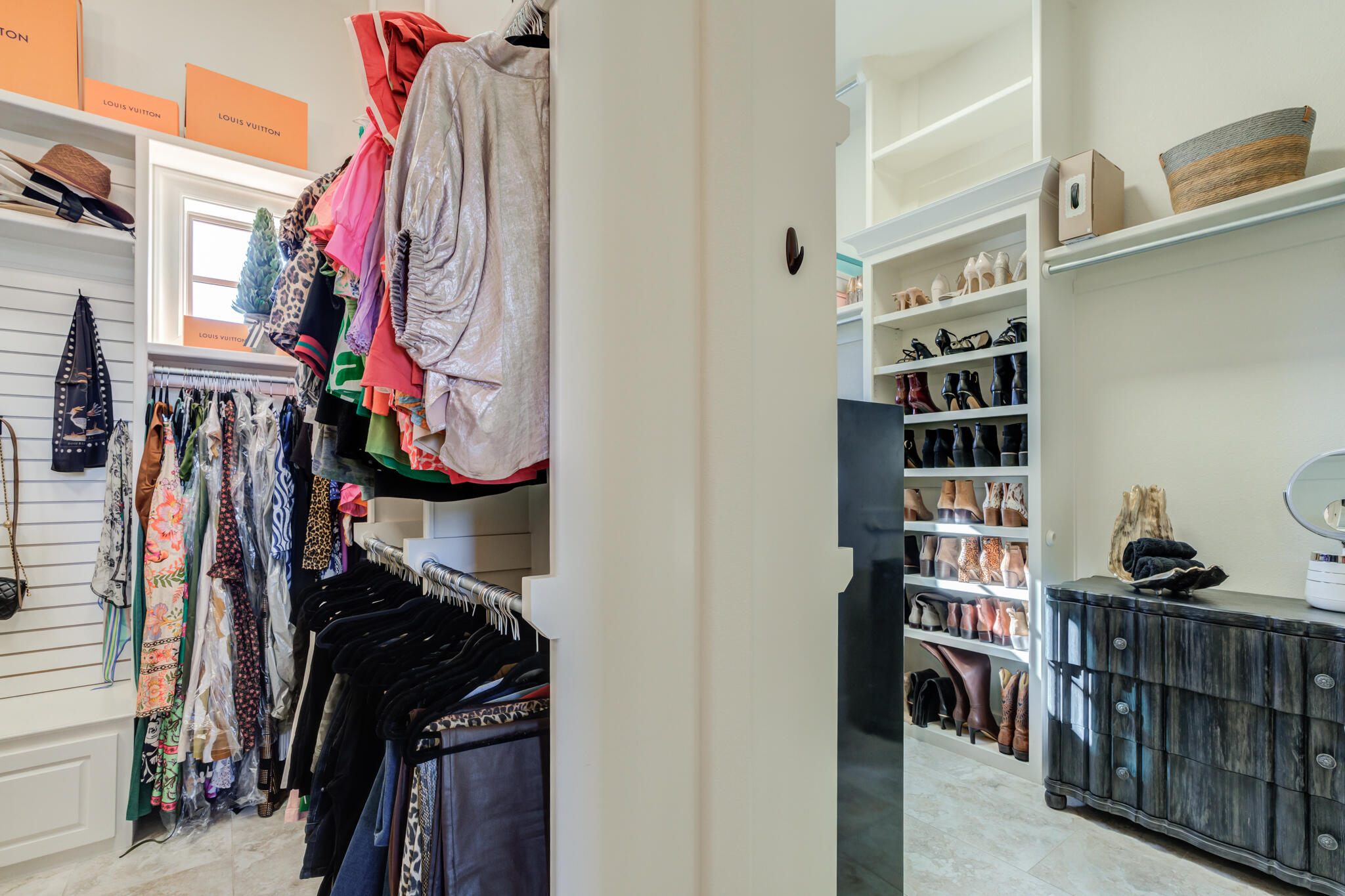 5006 117th Street Lubbock, TX 79424 - Photo 66 of 88 a view of walk in closet with clothes and shoes