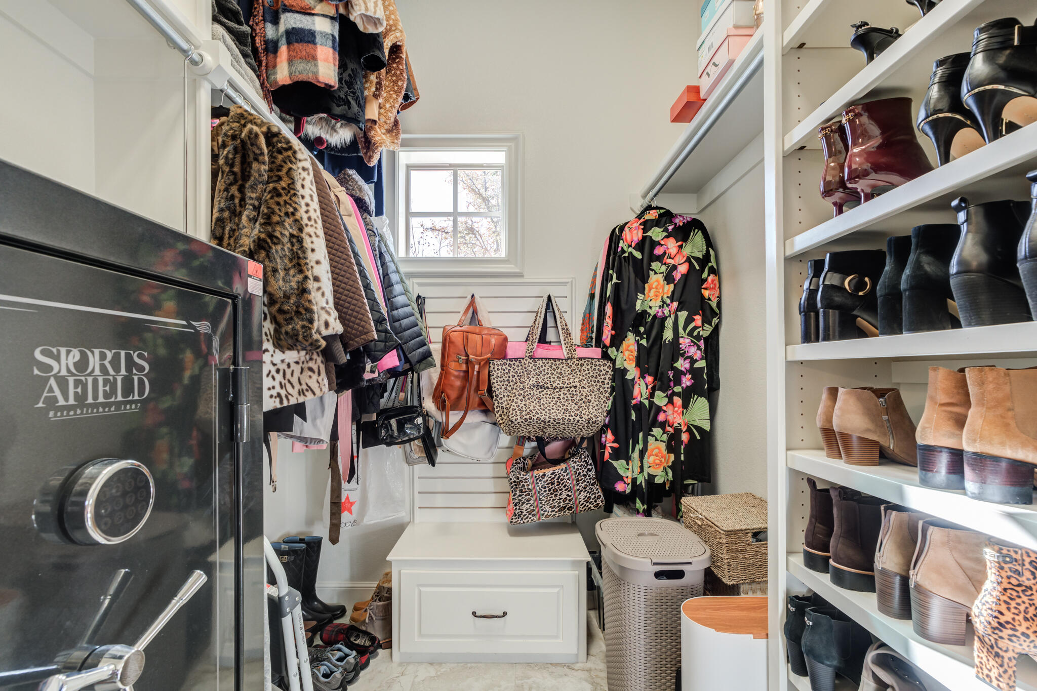 5006 117th Street Lubbock, TX 79424 - Photo 67 of 88 a view of walk in closet with clothes and shoes