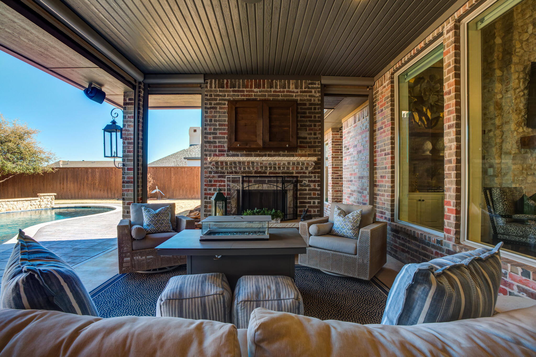 5006 117th Street Lubbock, TX 79424 - Photo 74 of 88 a living room with furniture fireplace and a large window