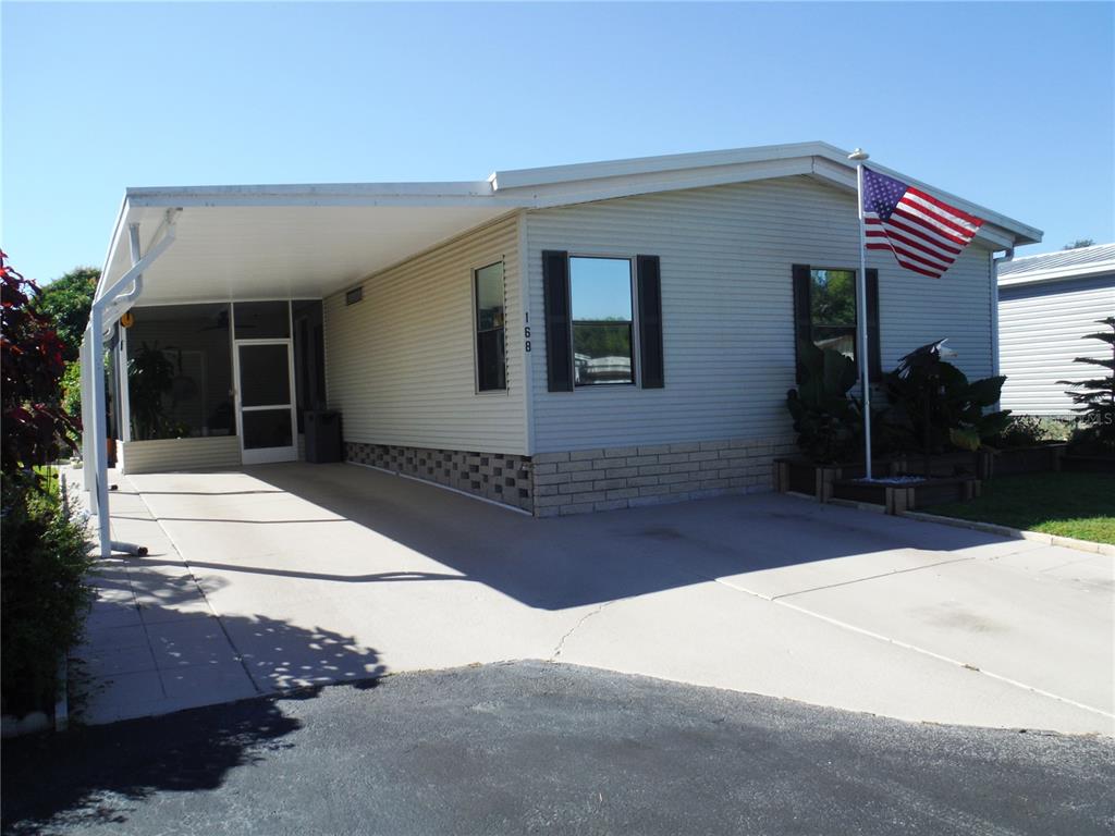 168 Pinewood Terrace, Unit 104 Safety Harbor, FL 34695 - Photo 1 of 55 a front view of a house