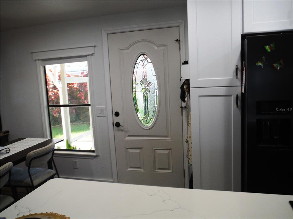 168 Pinewood Terrace, Unit 104 Safety Harbor, FL 34695 - Photo 13 of 55 a bedroom with a bed and a window