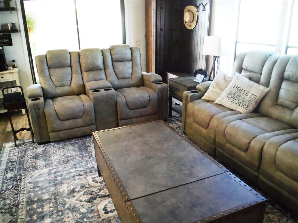 168 Pinewood Terrace, Unit 104 Safety Harbor, FL 34695 - Photo 2 of 55 a living room with furniture