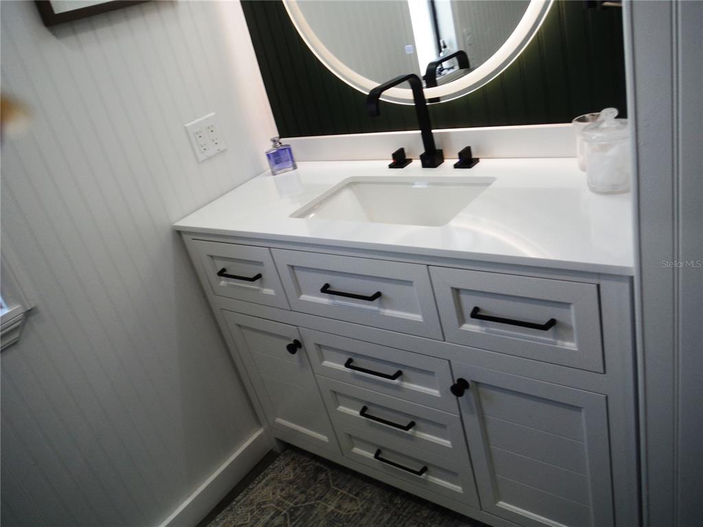 168 Pinewood Terrace, Unit 104 Safety Harbor, FL 34695 - Photo 25 of 55 a close view of dresser