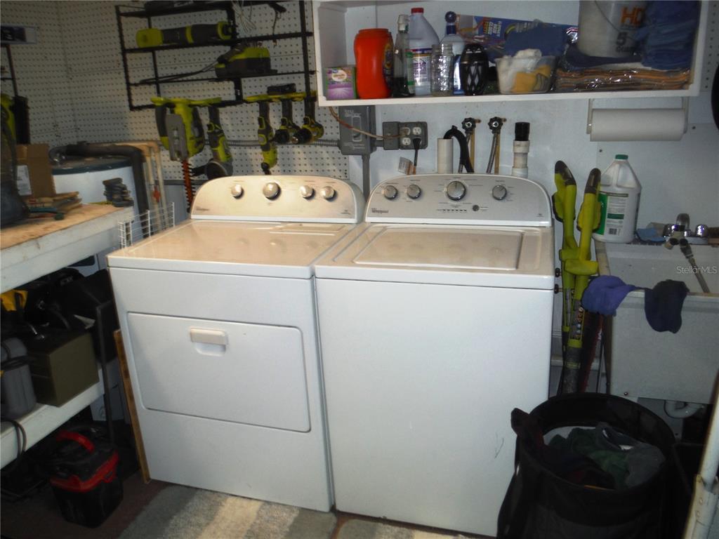 168 Pinewood Terrace, Unit 104 Safety Harbor, FL 34695 - Photo 37 of 55 a utility room with dryer and washer