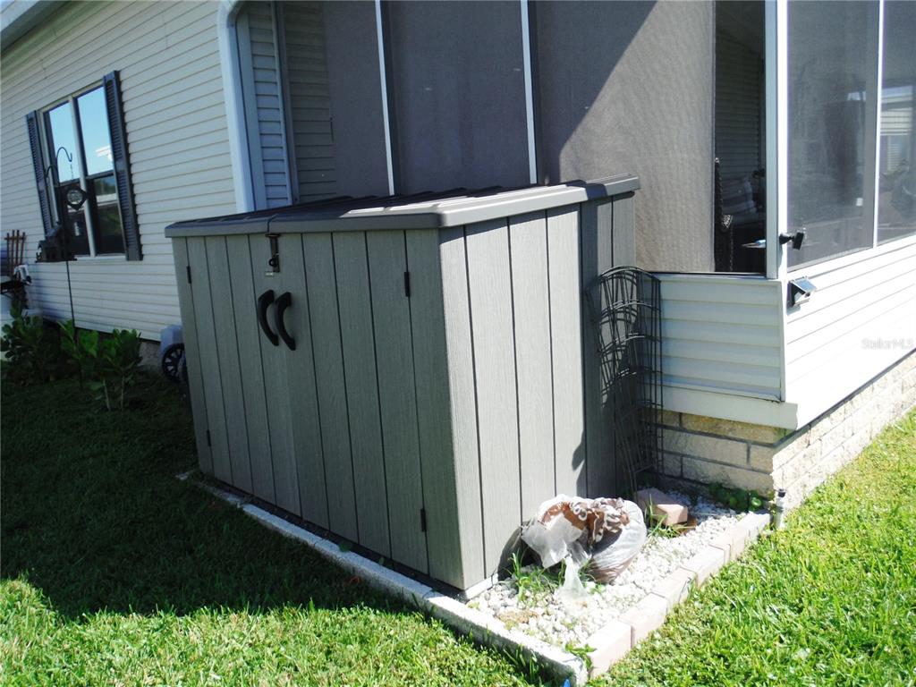 168 Pinewood Terrace, Unit 104 Safety Harbor, FL 34695 - Photo 42 of 55 a house view with a garden space
