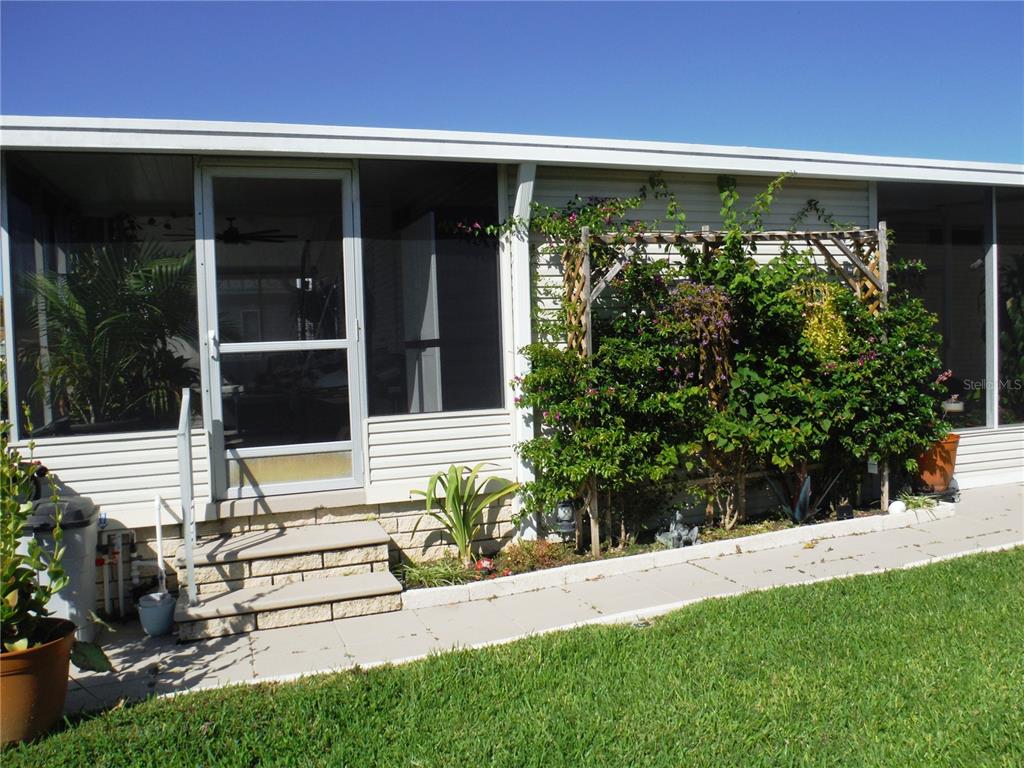 168 Pinewood Terrace, Unit 104 Safety Harbor, FL 34695 - Photo 47 of 55 a view of a back yard of the house