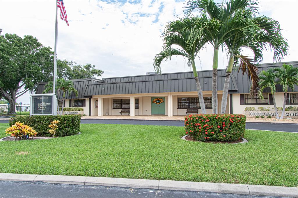 168 Pinewood Terrace, Unit 104 Safety Harbor, FL 34695 - Photo 49 of 55 a front view of a house with garden