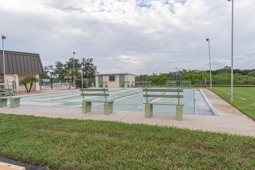 168 Pinewood Terrace, Unit 104 Safety Harbor, FL 34695 - Photo 53 of 55 a view of a park with swings and slides