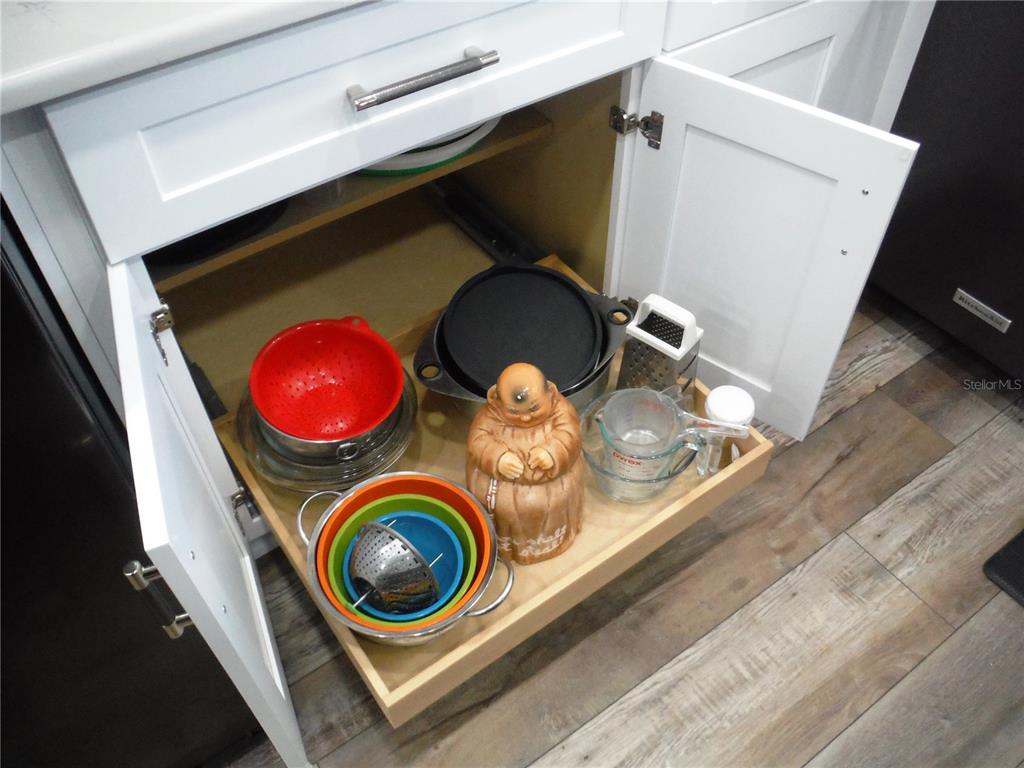 168 Pinewood Terrace, Unit 104 Safety Harbor, FL 34695 - Photo 9 of 55 a utility room with dryer and washer