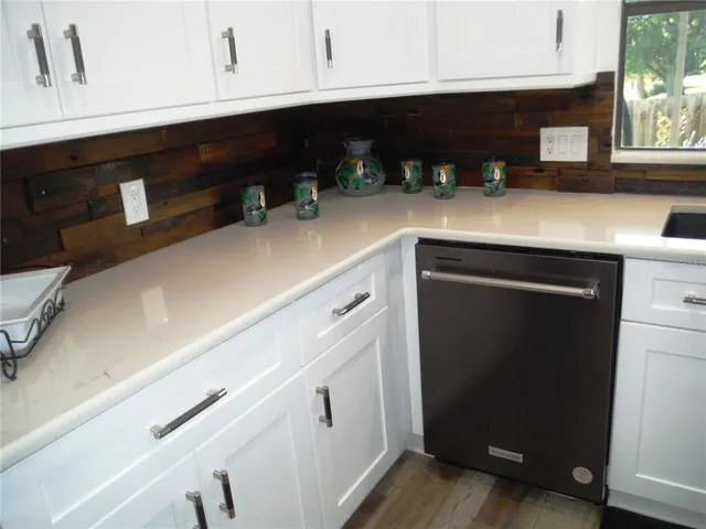 a kitchen with a sink and cabinets