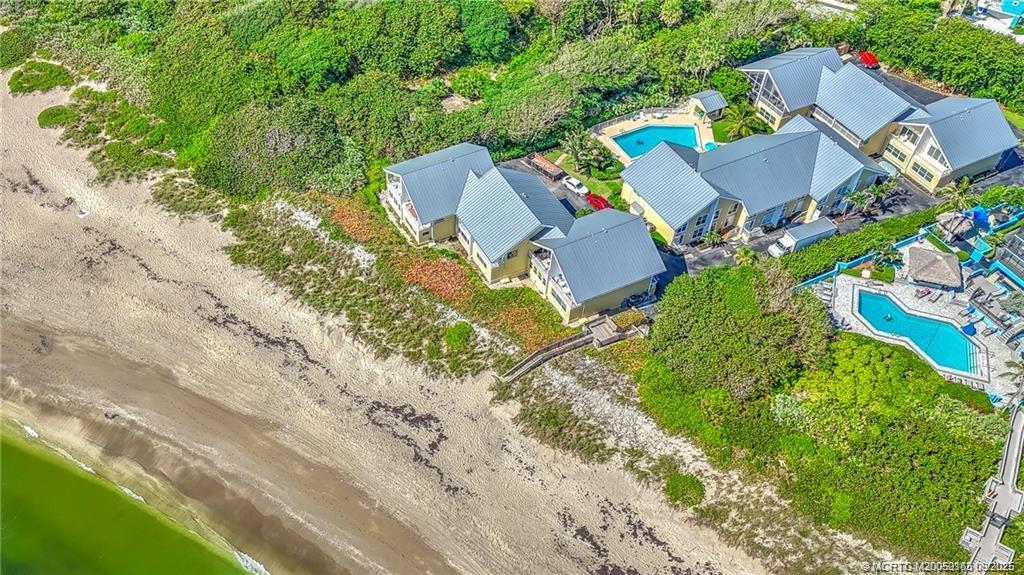245 Northeast MacArthur Boulevard, Unit 18 Stuart, FL 34996 - Photo 13 of 15 an aerial view of a house with a garden