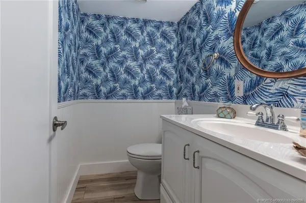 a kitchen with stainless steel appliances granite countertop a refrigerator stove and sink