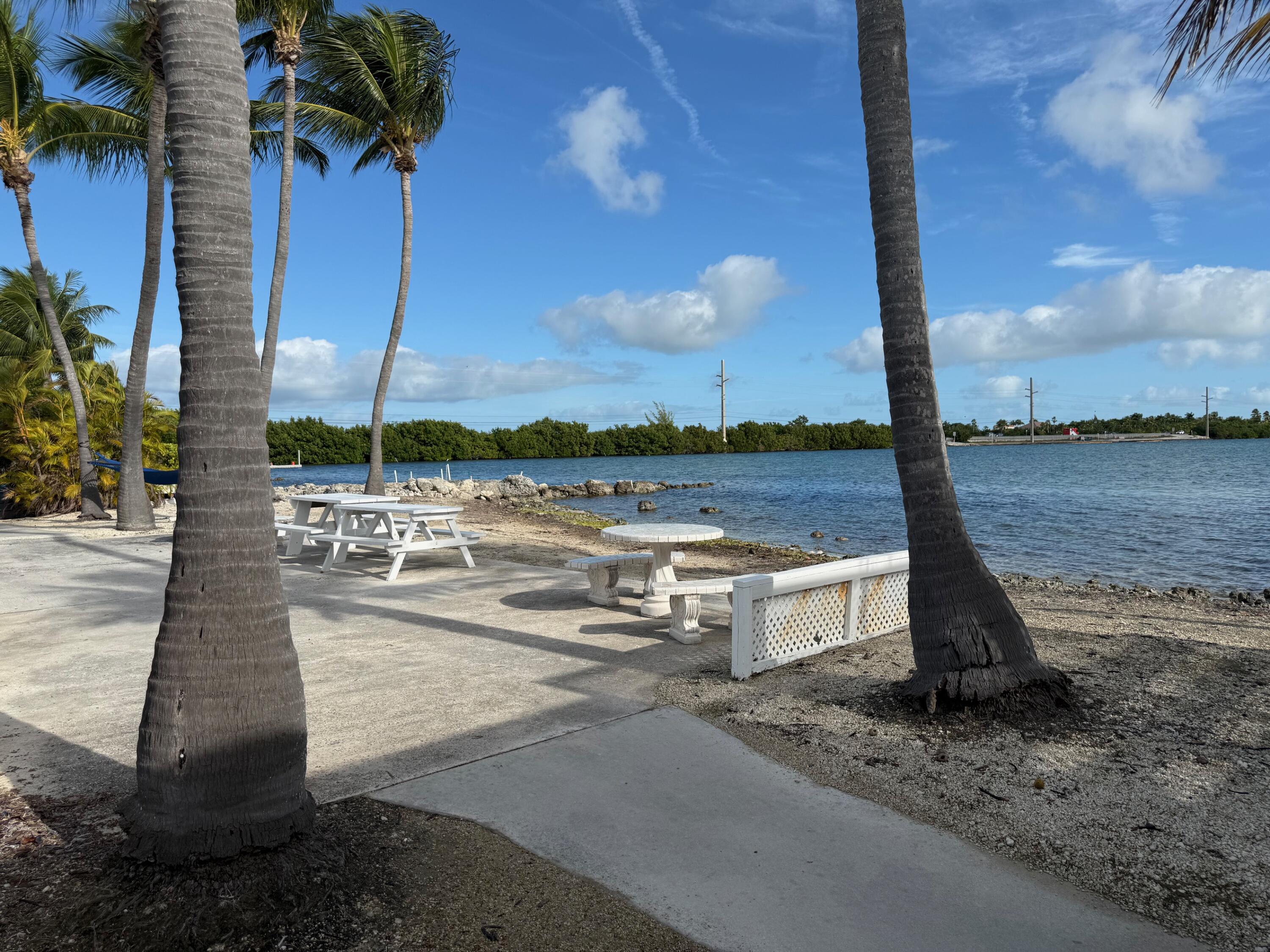 55 Boca Chica Road, Unit 57 Key West, FL 33040 - Photo 14 of 20 a view of a terrace with sitting area