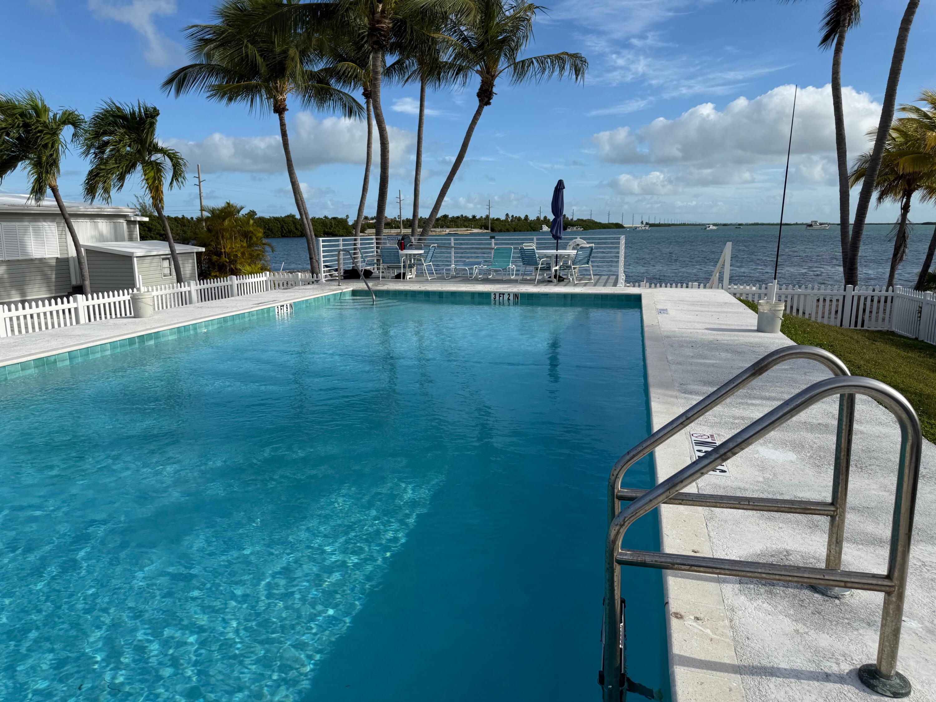 55 Boca Chica Road, Unit 57 Key West, FL 33040 - Photo 17 of 20 a view of outdoor space with seating area