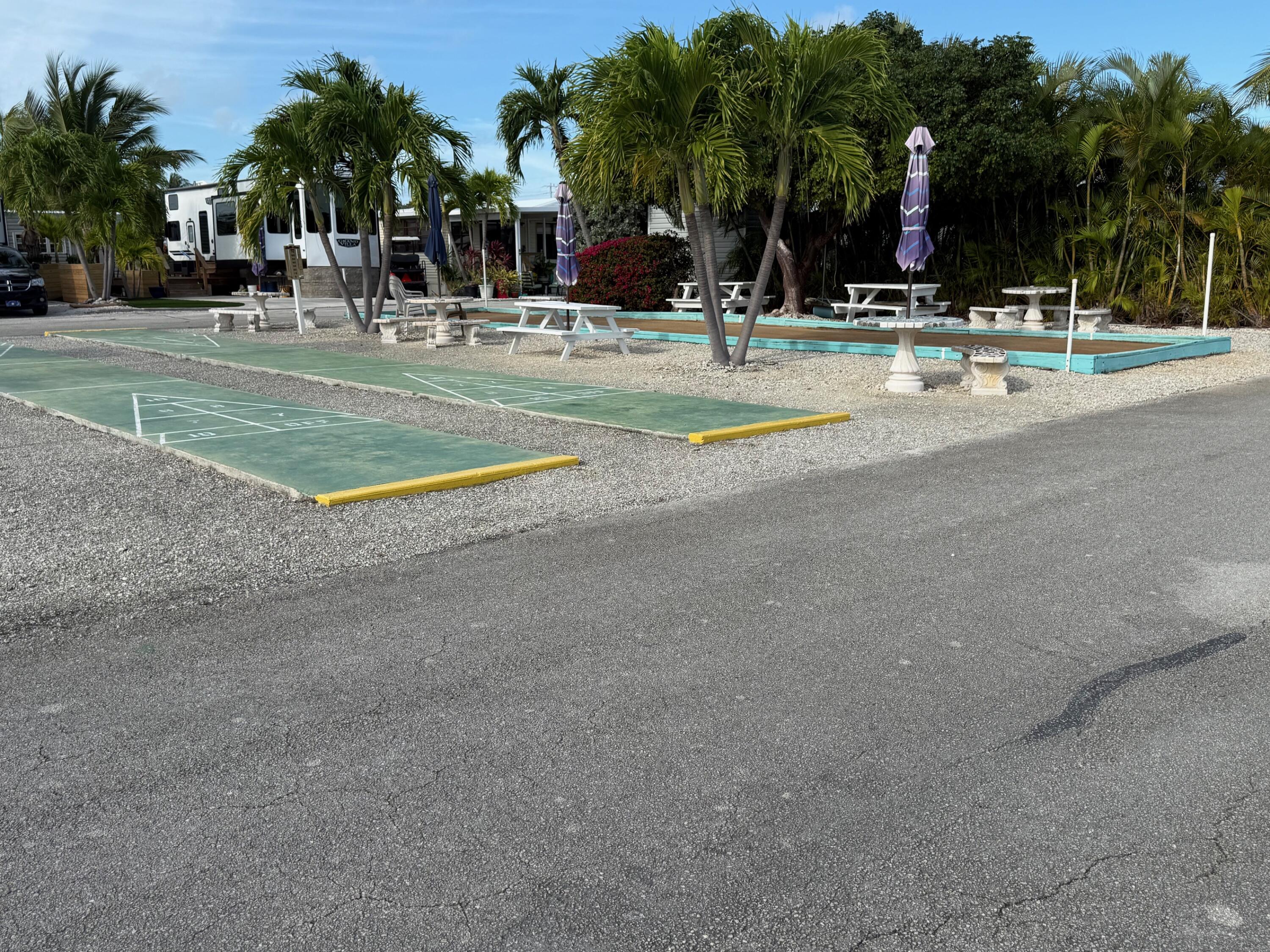 55 Boca Chica Road, Unit 57 Key West, FL 33040 - Photo 20 of 20 a view of a playground with palm trees