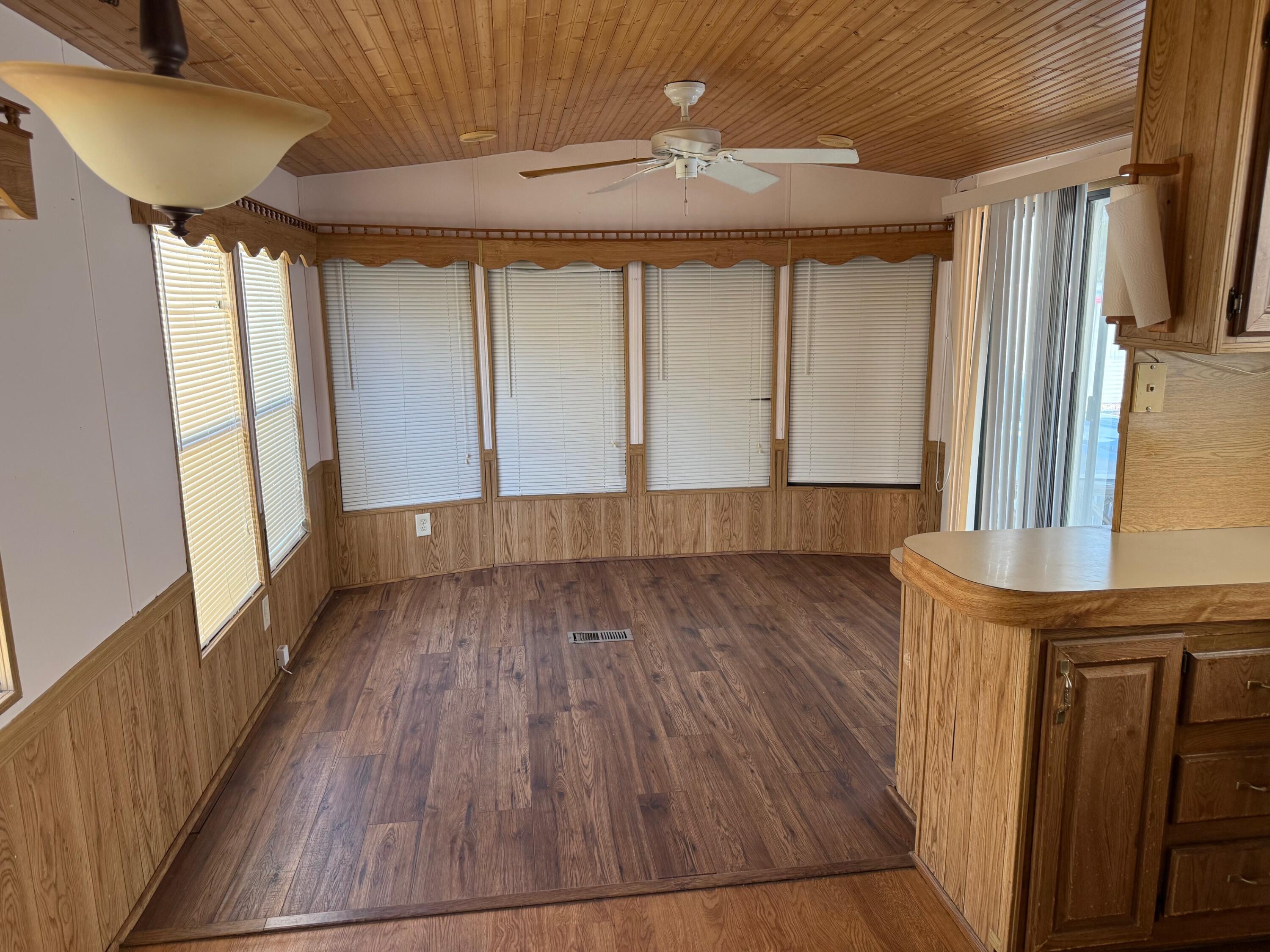 55 Boca Chica Road, Unit 57 Key West, FL 33040 - Photo 2 of 20 a view of a room with wooden floor and staircase