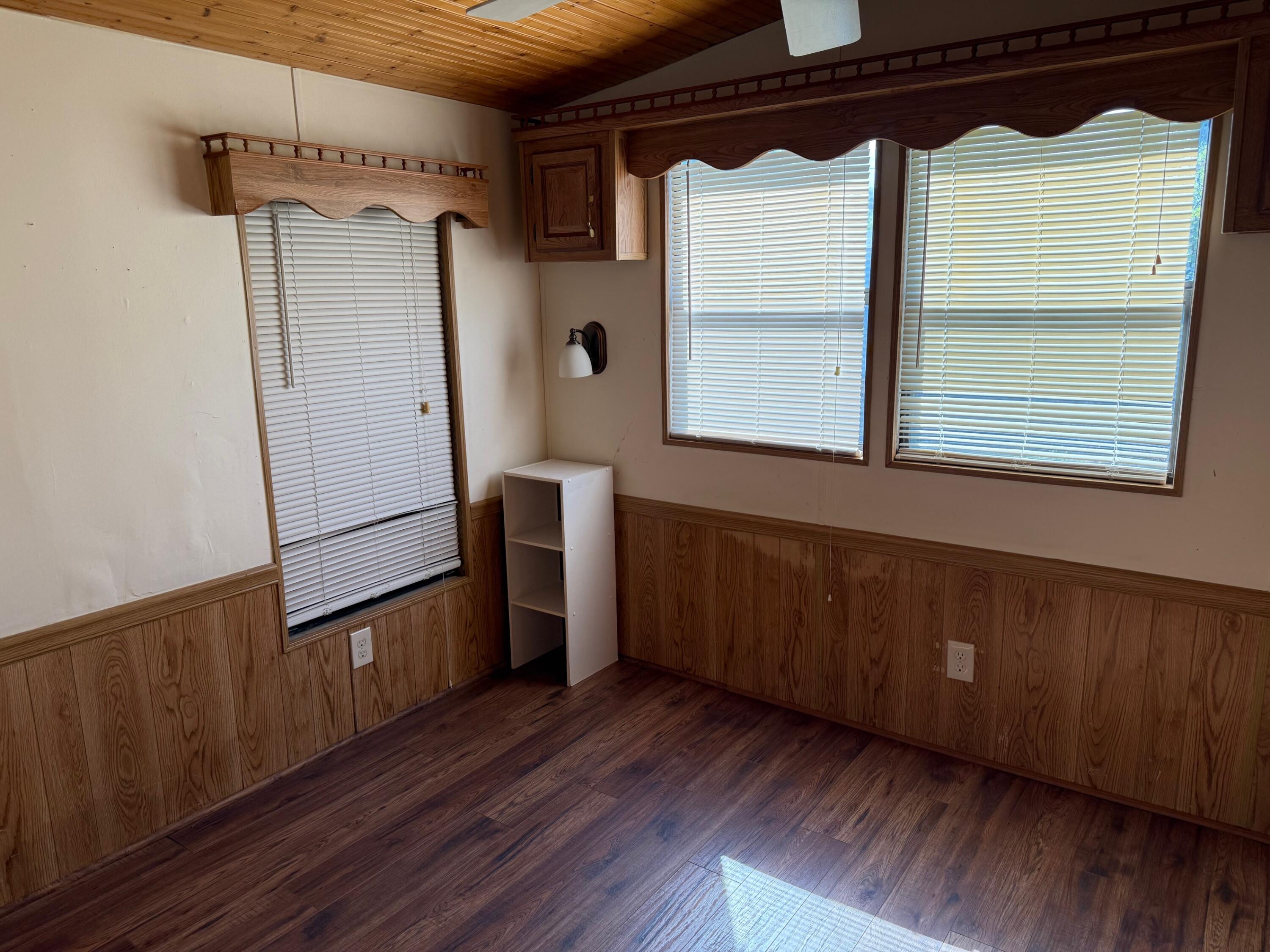 55 Boca Chica Road, Unit 57 Key West, FL 33040 - Photo 4 of 20 a view of a room with wooden floor and a window