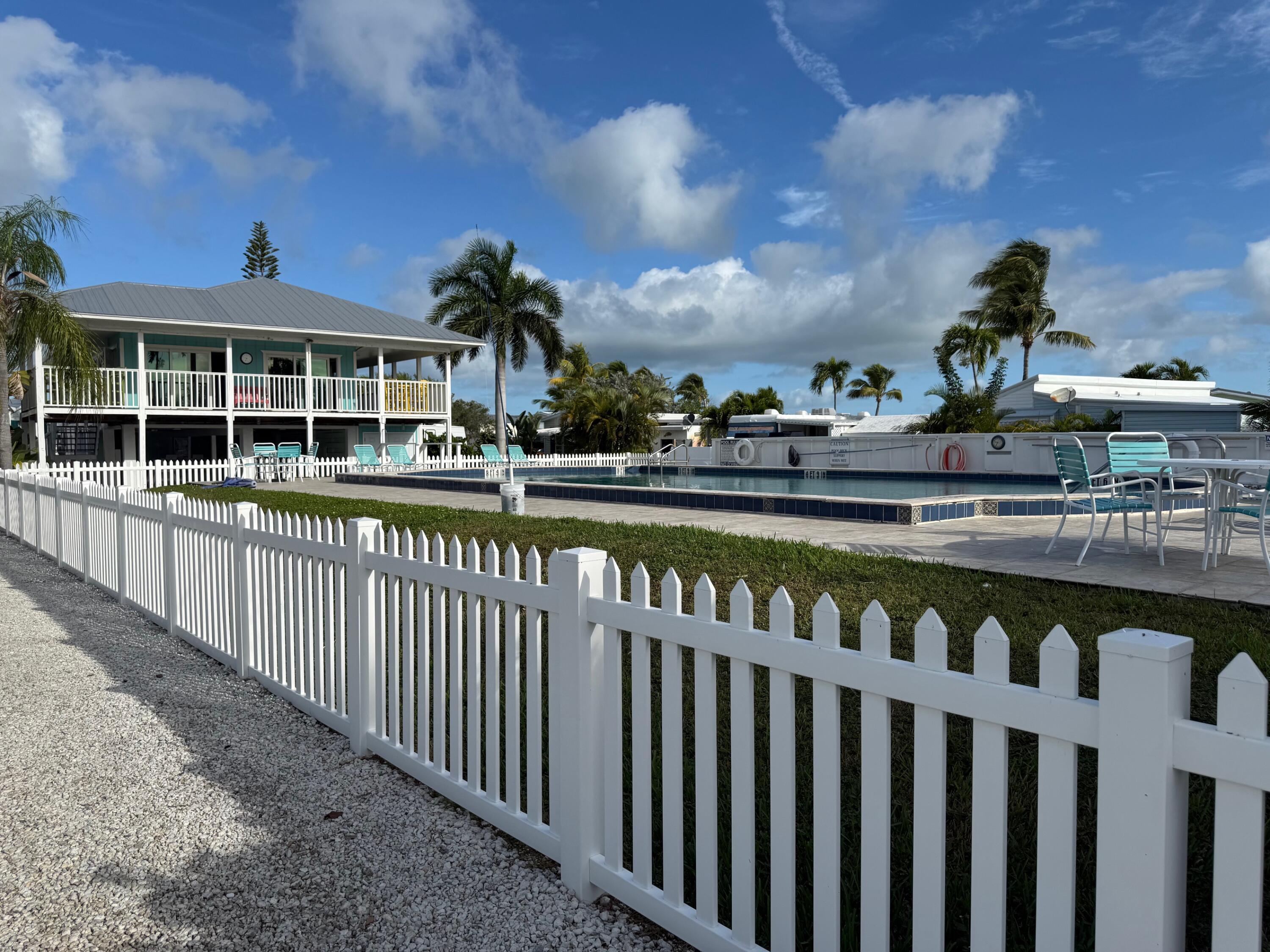 55 Boca Chica Road, Unit 57 Key West, FL 33040 - Photo 9 of 20 a view of a street with wooden fence