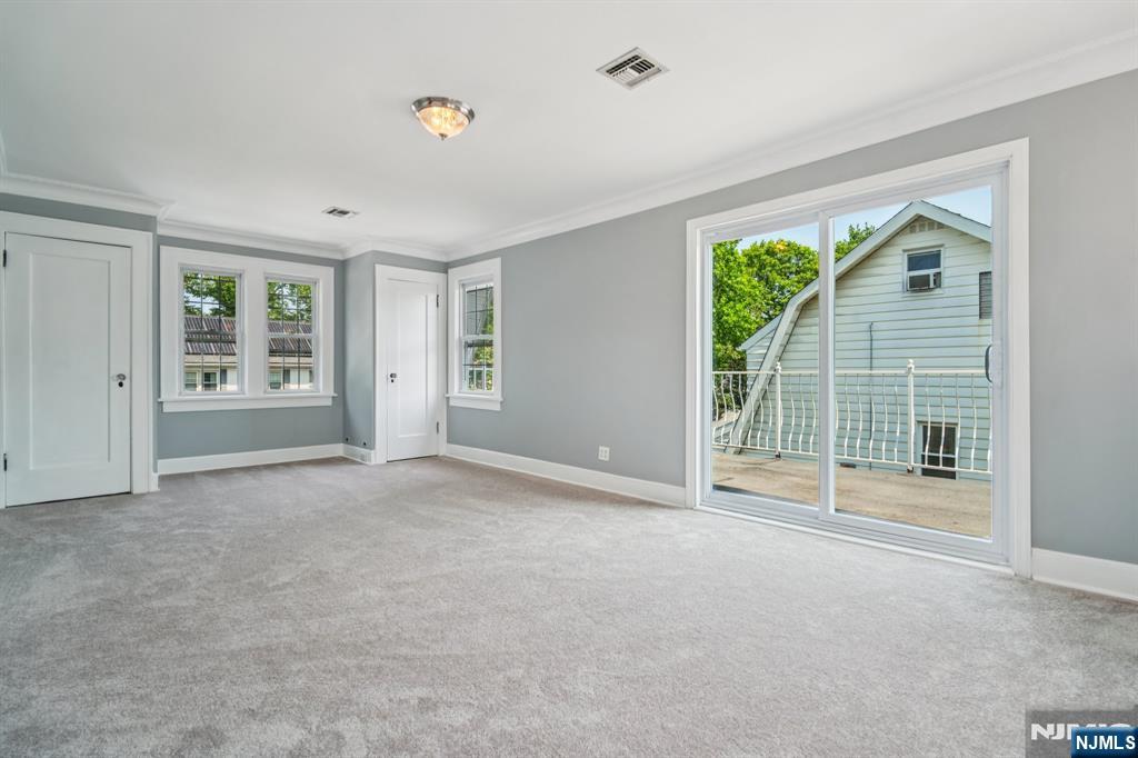 217 Grayson Place Teaneck, NJ 07666 - Photo 22 of 40 a view of an empty room with a window