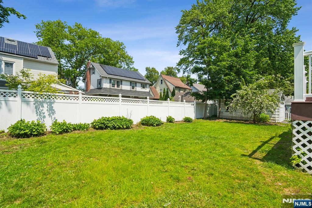 217 Grayson Place Teaneck, NJ 07666 - Photo 30 of 40 a front view of a house with garden