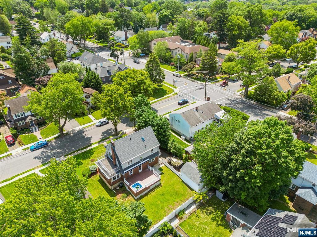 217 Grayson Place Teaneck, NJ 07666 - Photo 37 of 40 an aerial view of a house with a garden and swimming pool
