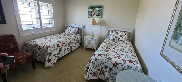 a bedroom with bed and a window