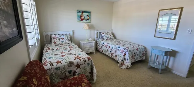 a bedroom with bed and a window