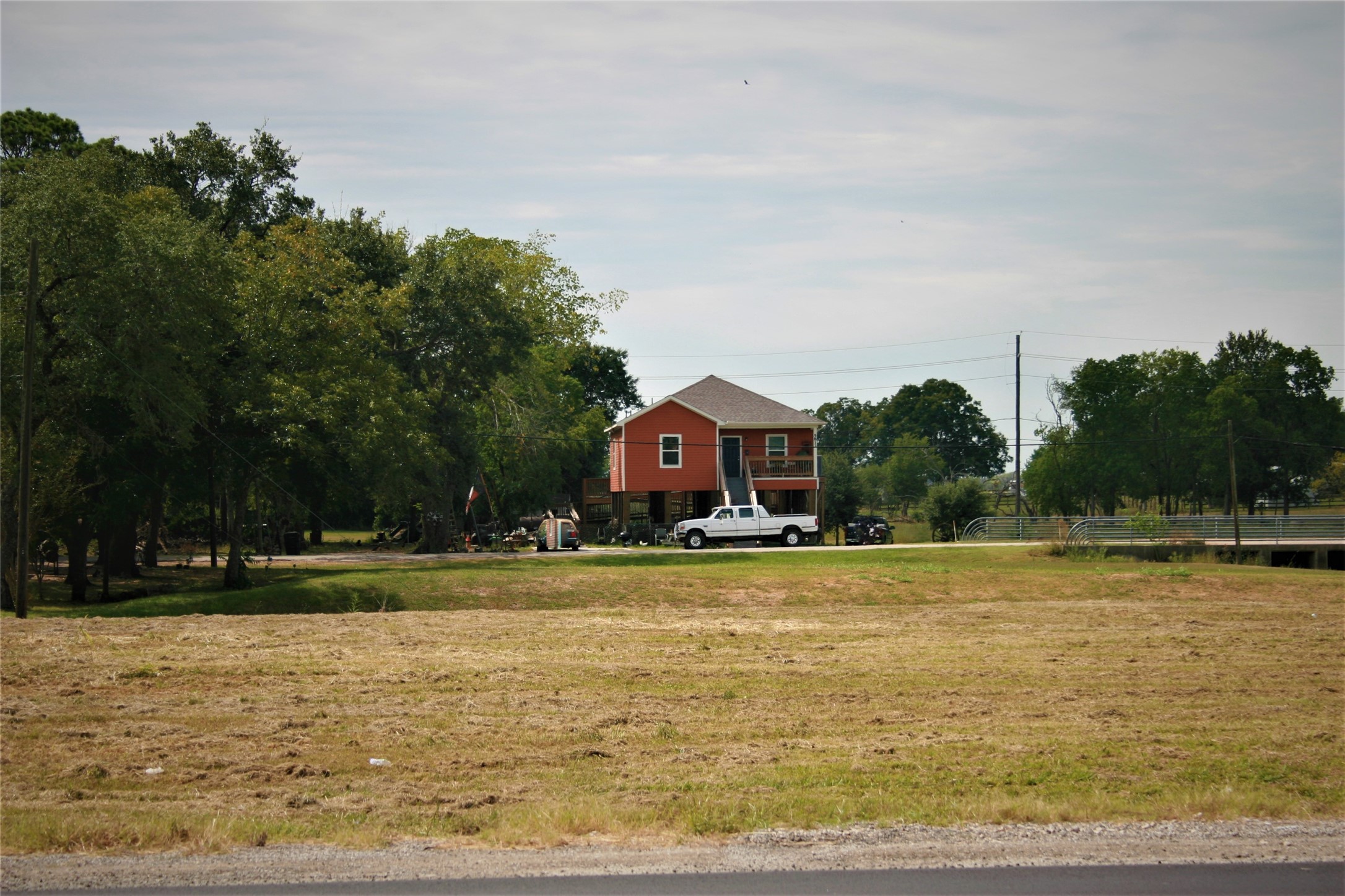 5815 Commerce Street Wallis, TX 77485 - Photo 4 of 6 a view of a swimming pool and trees in the background