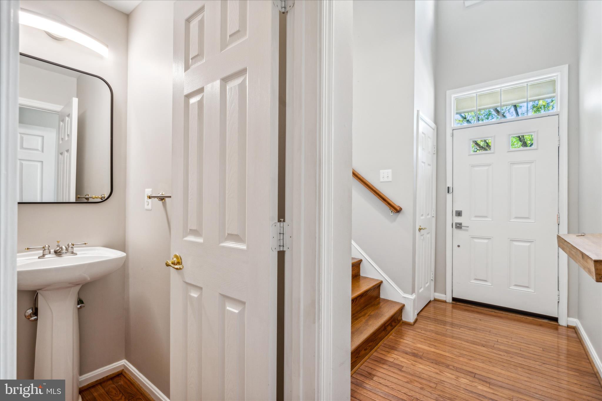 2442 Rippling Brook Road Frederick, MD 21701 - Photo 4 of 85 a bathroom with a sink and a mirror