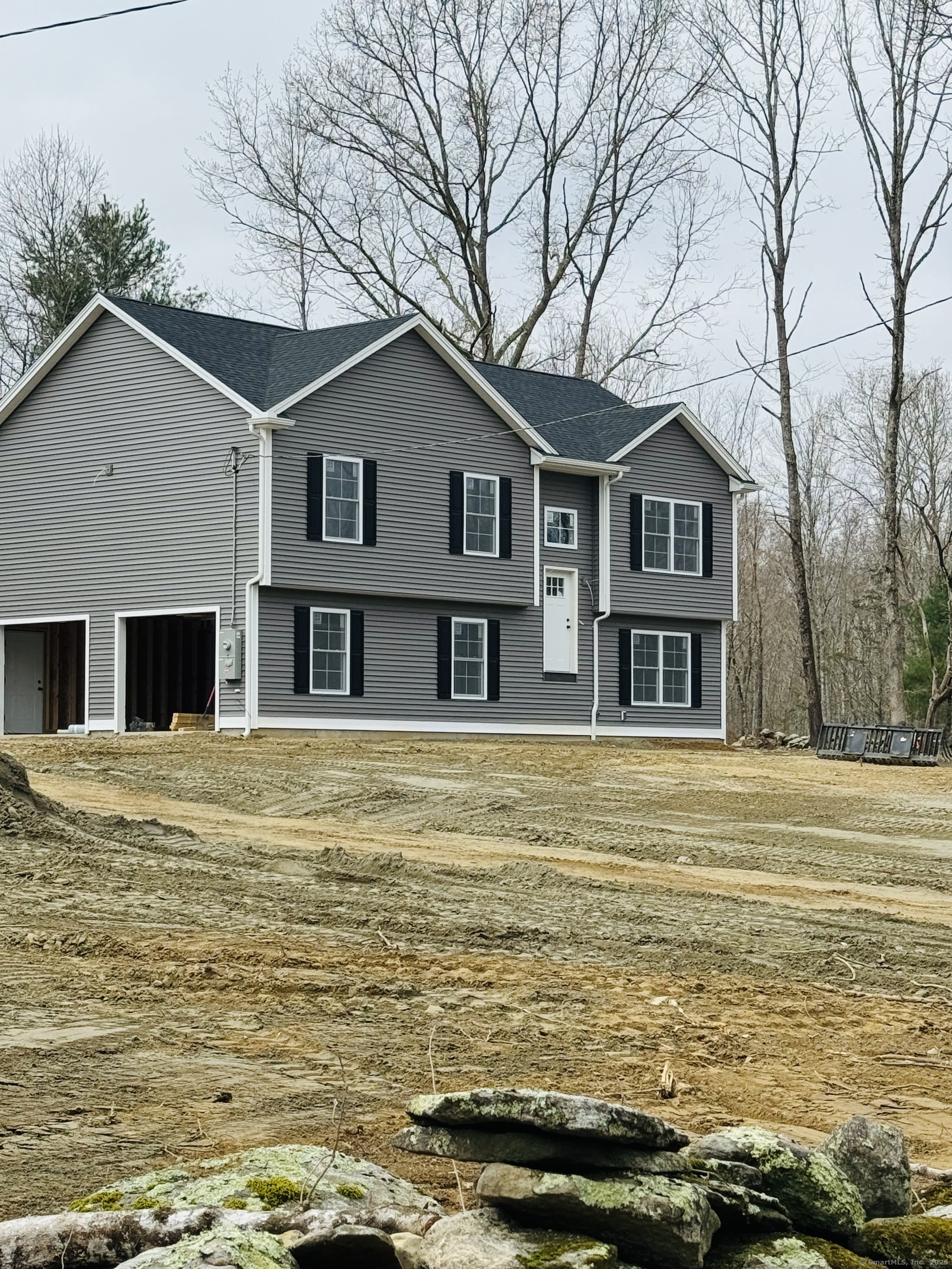a front view of a house with a ocean beach