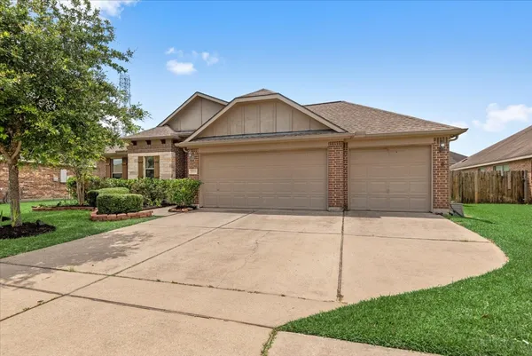 a front view of a house with yard