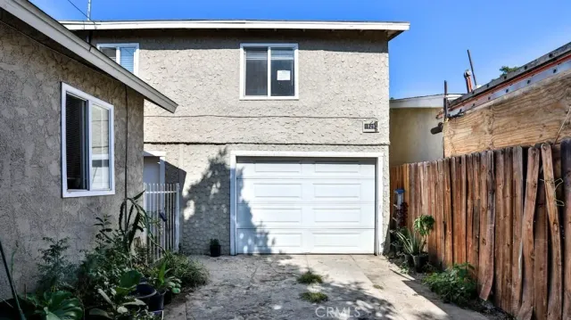 a front view of a house with garage