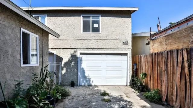a front view of a house with garage