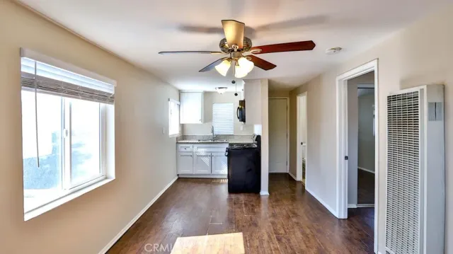 a view of a kitchen with a sink and a window