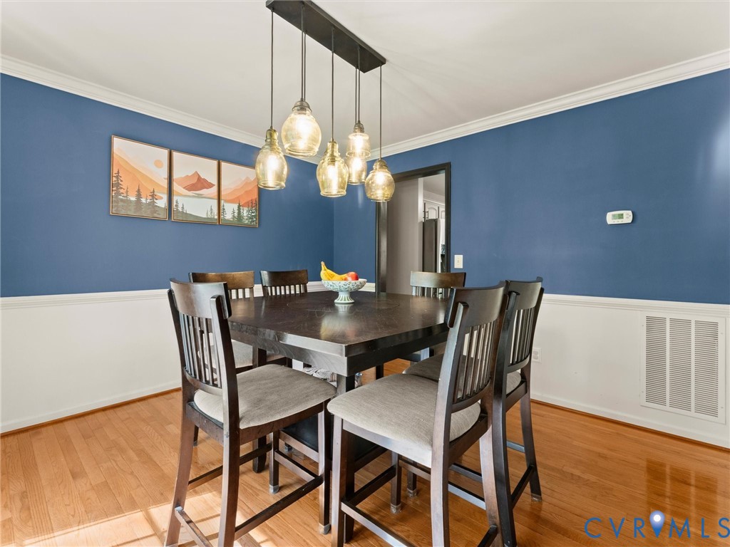 126 Reedy Creek Road Louisa, VA 23093 - Photo 13 of 65 This dining area features hardwood floors and a st