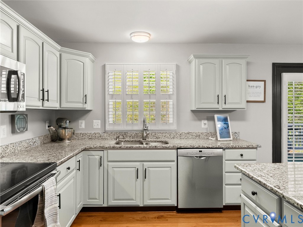 126 Reedy Creek Road Louisa, VA 23093 - Photo 22 of 65 The kitchen features ample cabinetry, speckled cou