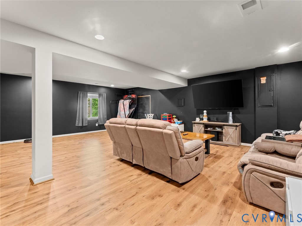126 Reedy Creek Road Louisa, VA 23093 - Photo 27 of 65 This spacious room features light-toned wood floor