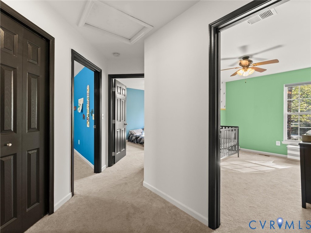 126 Reedy Creek Road Louisa, VA 23093 - Photo 35 of 65 Carpeted hallway with white walls and dark trim, l
