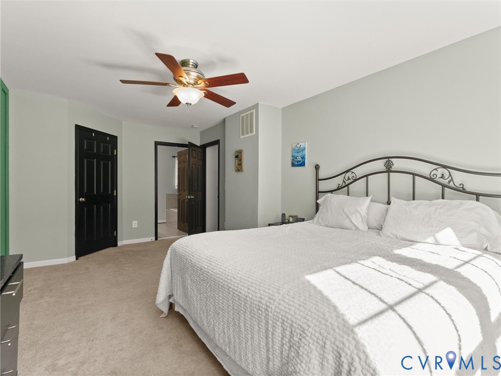 126 Reedy Creek Road Louisa, VA 23093 - Photo 38 of 65 The bedroom features neutral-toned carpet, light g
