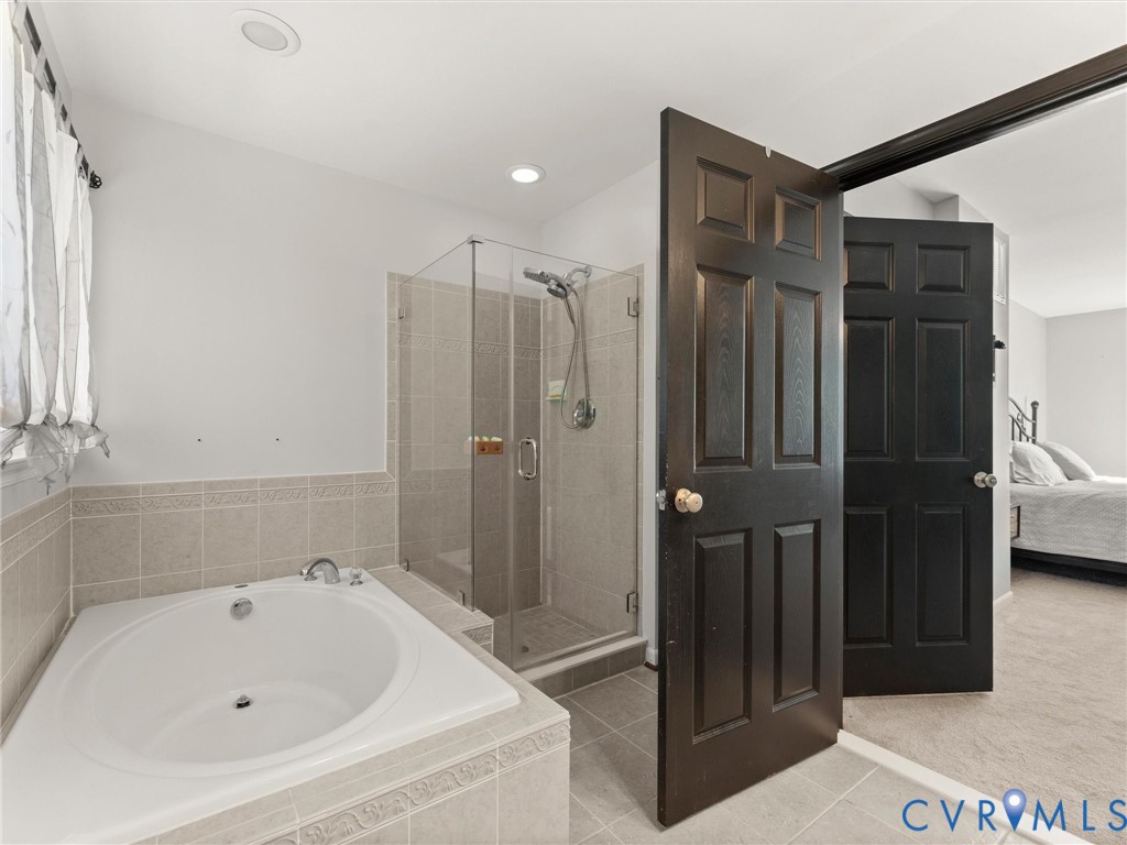 126 Reedy Creek Road Louisa, VA 23093 - Photo 42 of 65 This bathroom features a spacious built-in tub and