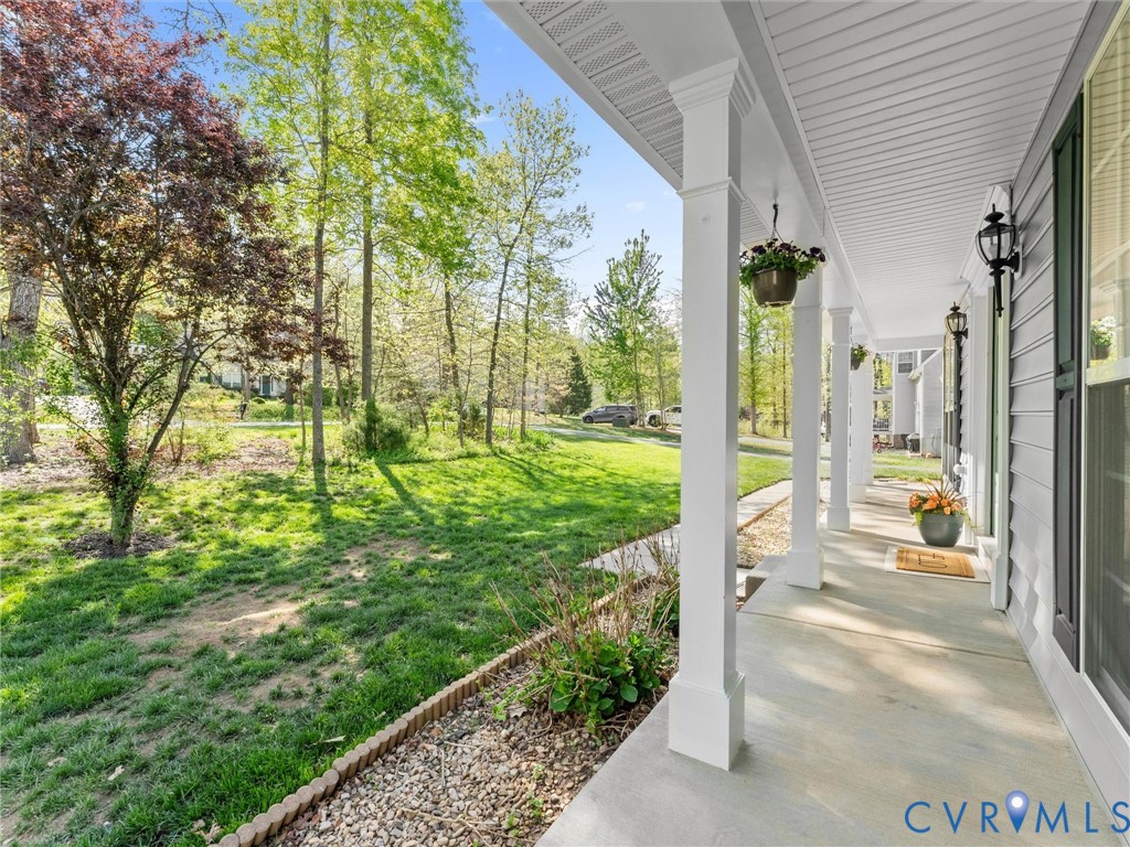 126 Reedy Creek Road Louisa, VA 23093 - Photo 6 of 65 The property features a charming covered porch wit
