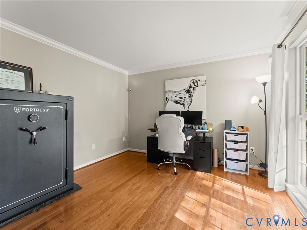 126 Reedy Creek Road Louisa, VA 23093 - Photo 8 of 65 This room features wood flooring, crown molding, a