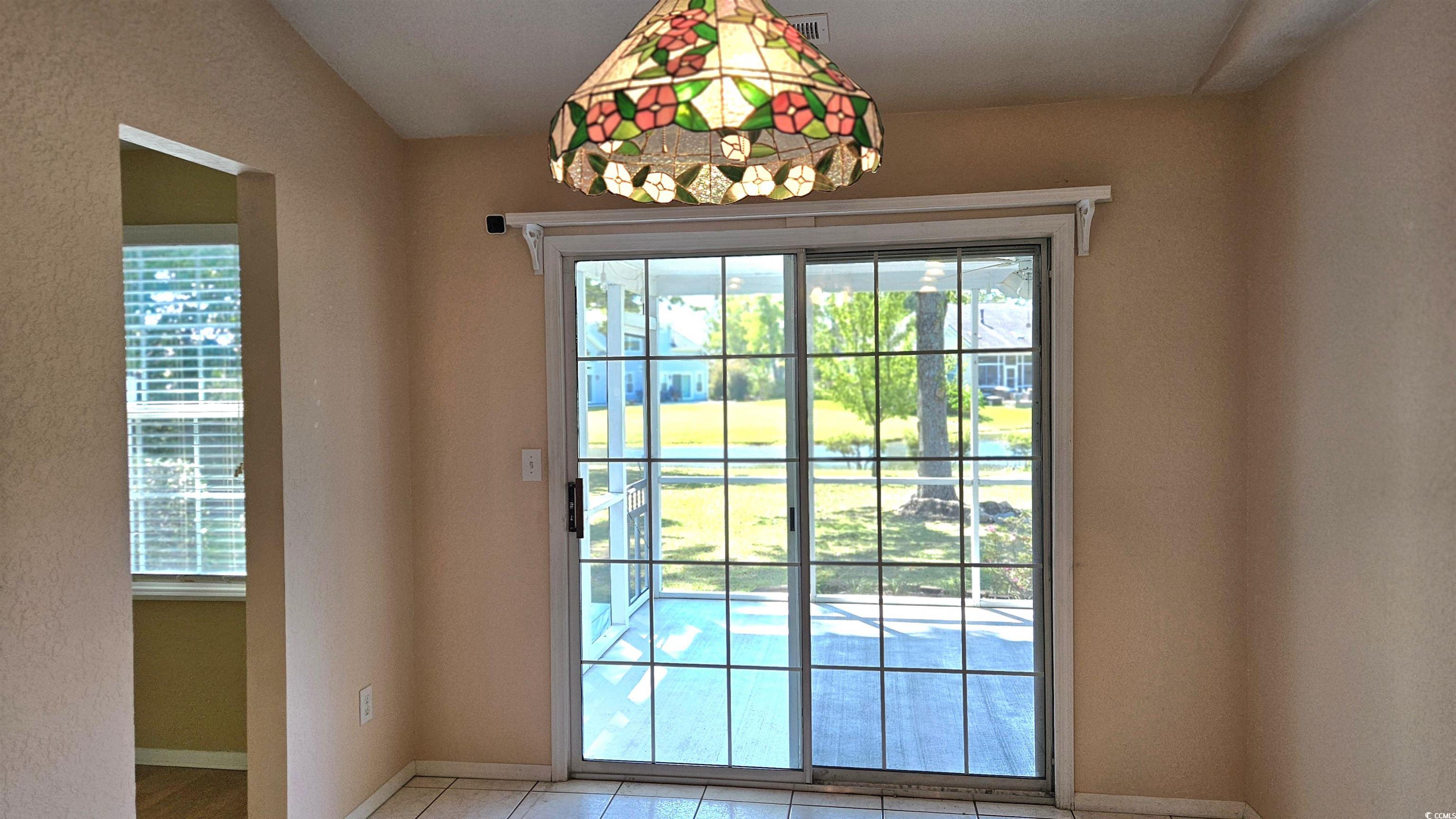 545 Saluda River Road Myrtle Beach, SC 29588 - Photo 12 of 25 Doorway with baseboards and tile patterned flooring