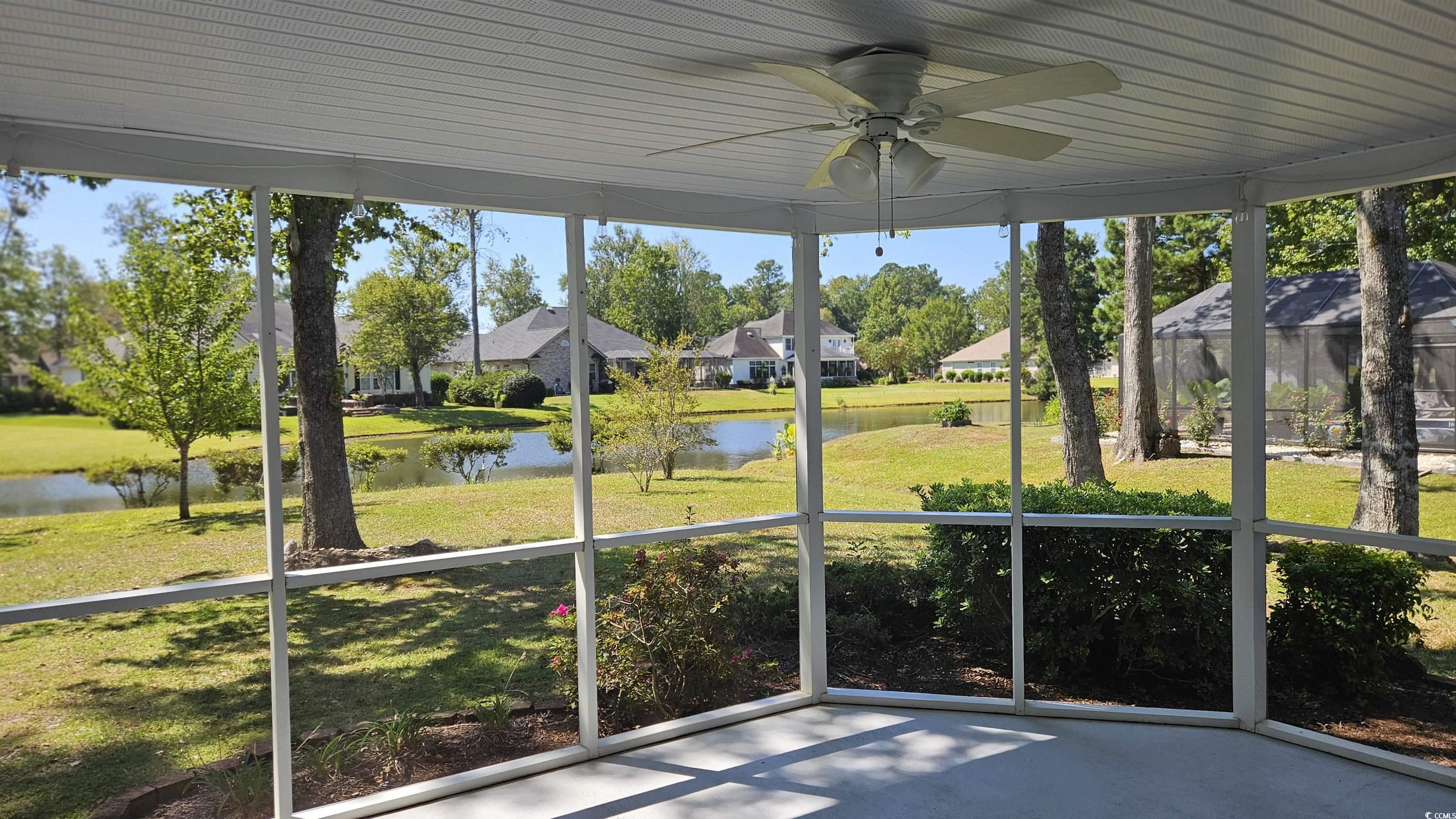 545 Saluda River Road Myrtle Beach, SC 29588 - Photo 14 of 25 Unfurnished sunroom with a water view and a ceiling fan