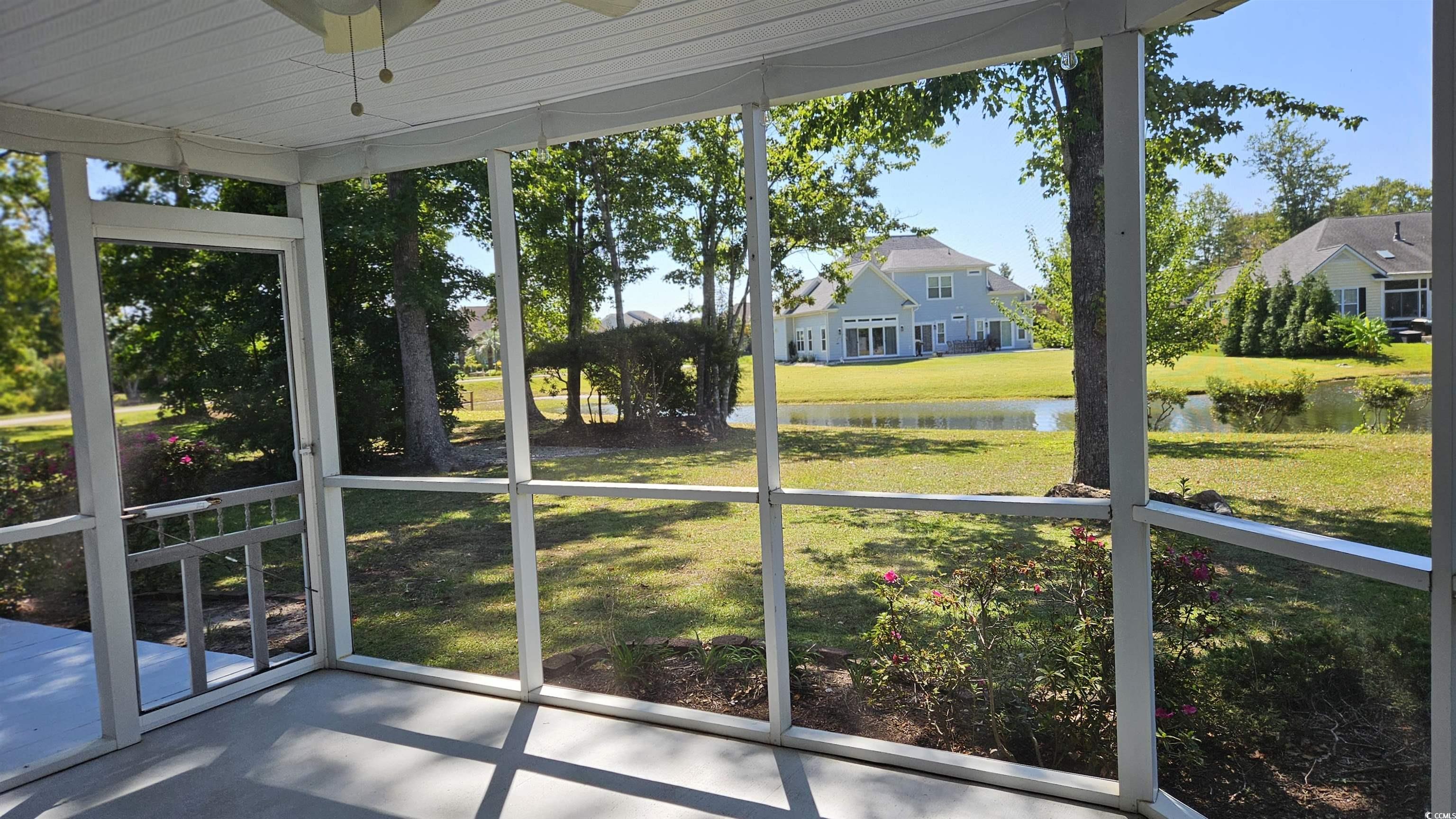 545 Saluda River Road Myrtle Beach, SC 29588 - Photo 15 of 25 Unfurnished sunroom with a water view and ceiling fan