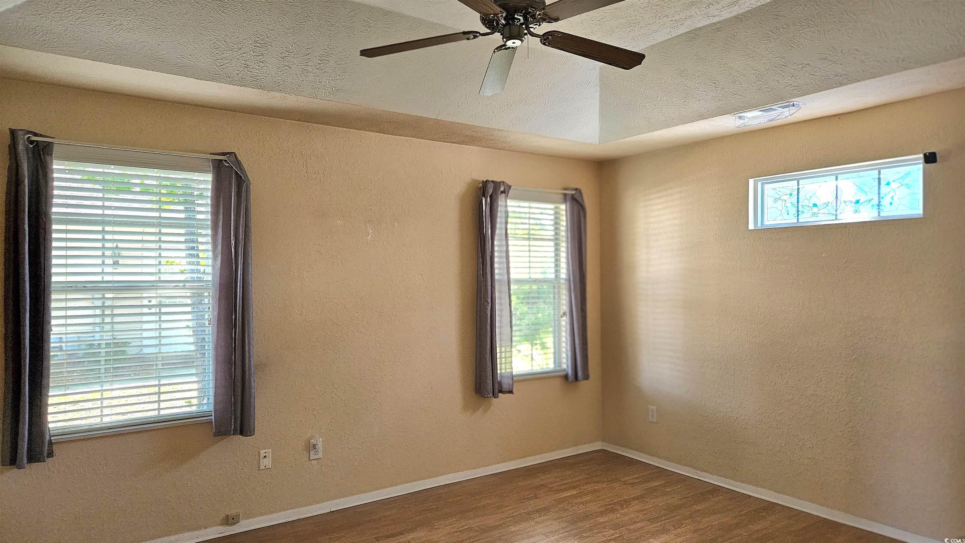 545 Saluda River Road Myrtle Beach, SC 29588 - Photo 17 of 25 Plenty of natural light, wood finished floors, and ceiling fan